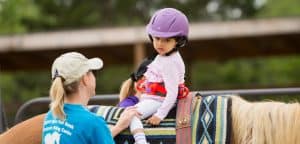 Therapeutic Riding - Child working with therapist